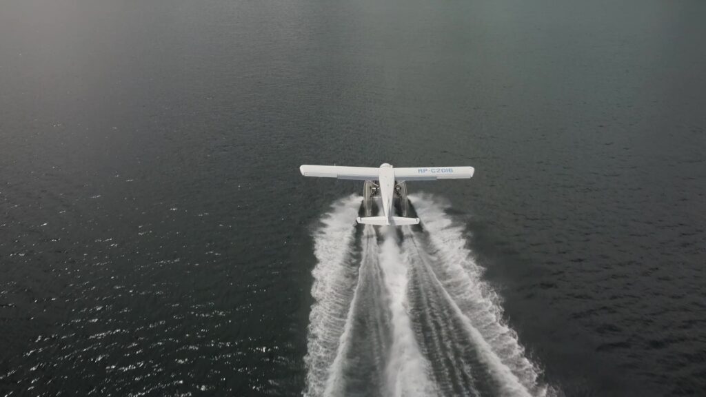 Float plane taking off the ocean